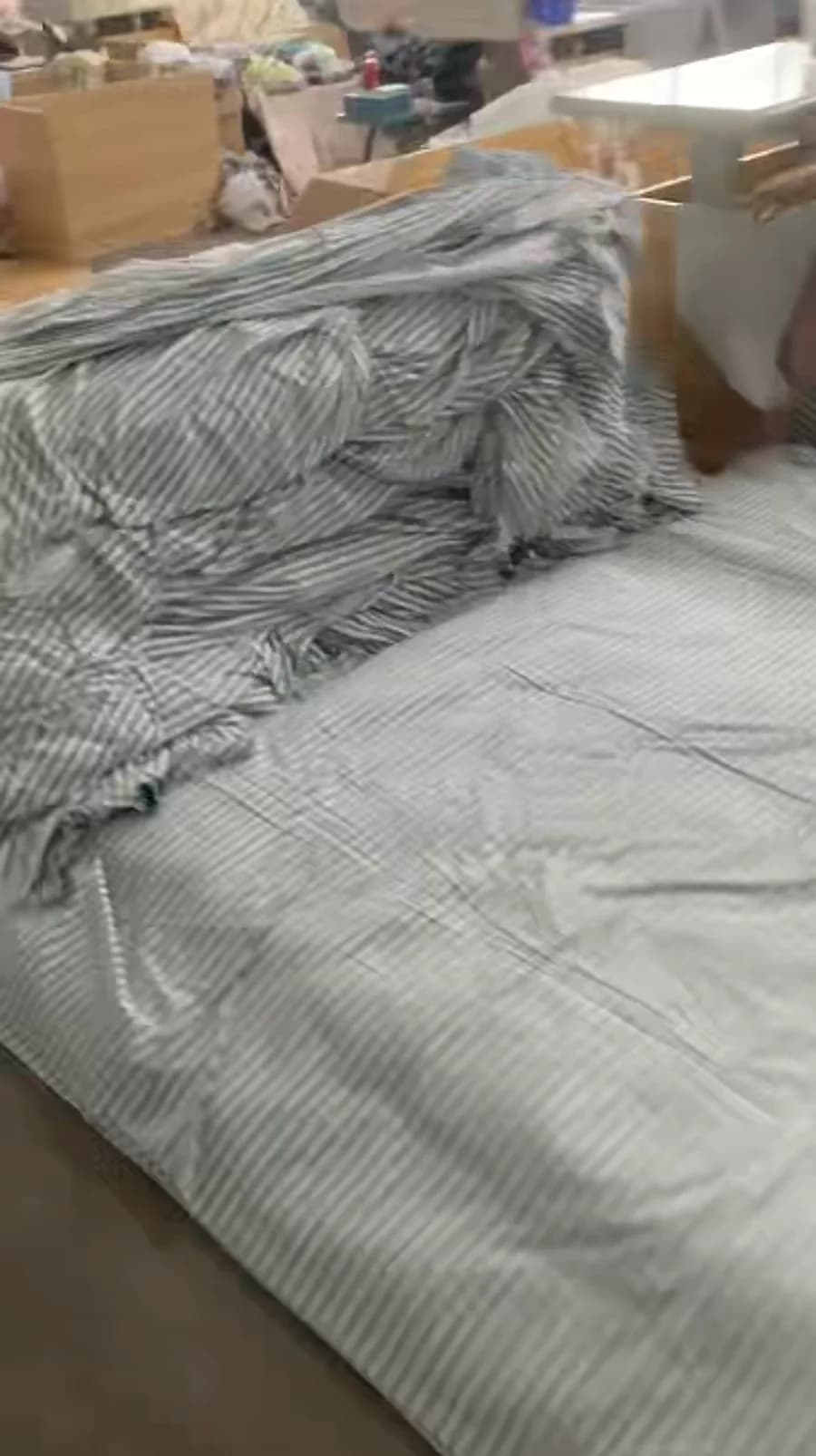 Finished bedding opened out on the inspection table for a final check