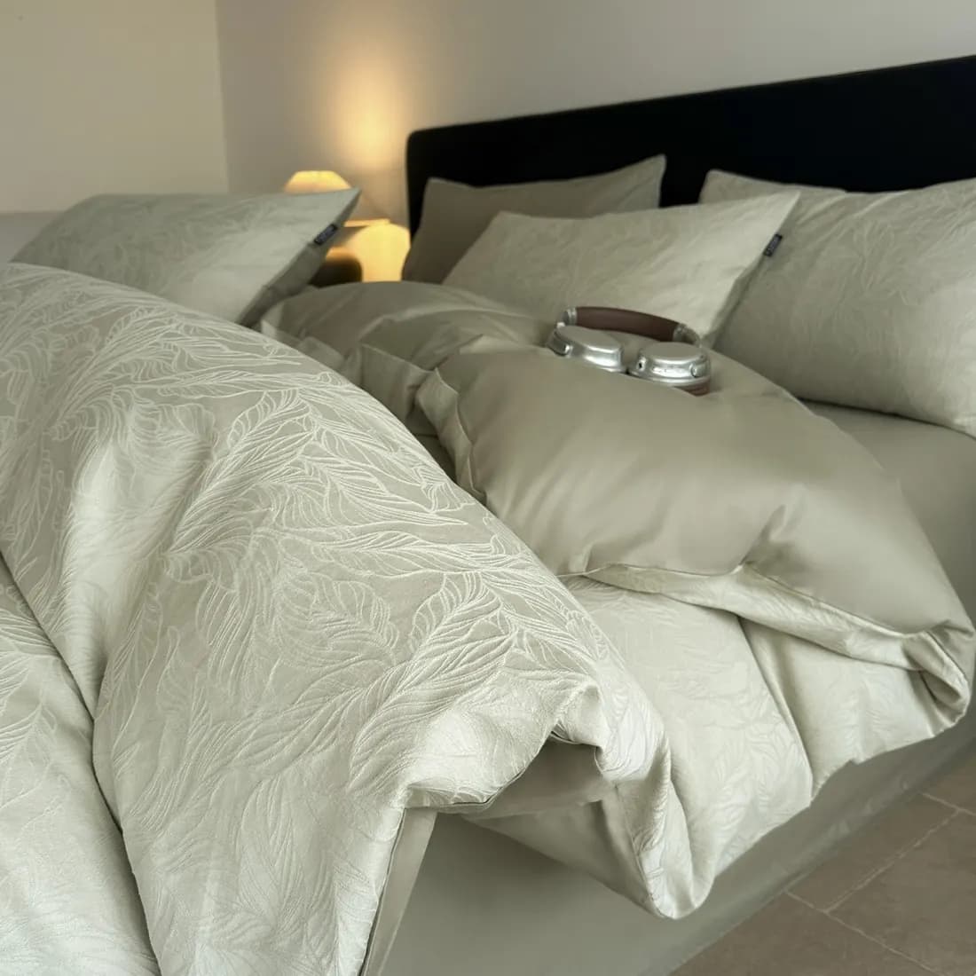 Close-up of reactive-printed floral sateen cotton bedding showing saturated color and soft hand-feel