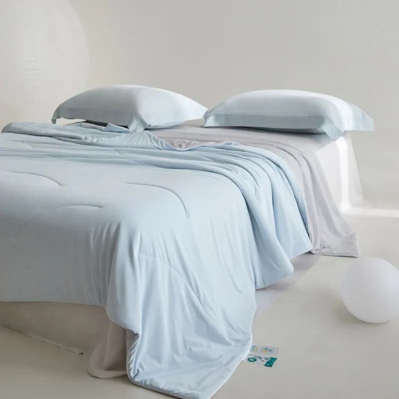 Ice Silk vs Modal vs Tencel Cooling Quilts: A Wholesale Buyer's Stocking Guide