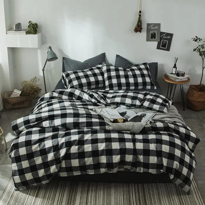 Close-up of fine sateen cotton bedding showing the smooth surface produced by high yarn count