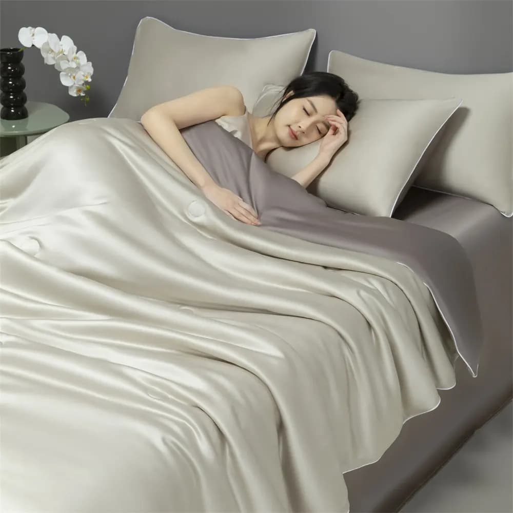 Folded bamboo lyocell bedding set showing smooth sateen surface and cool drape