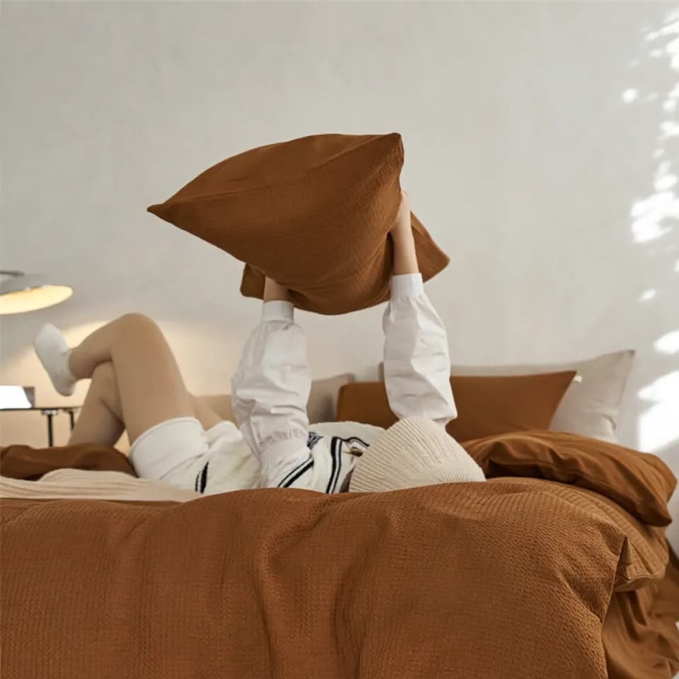 Close-up of woven long-staple cotton bedding fabric showing smooth even yarn and tight weave